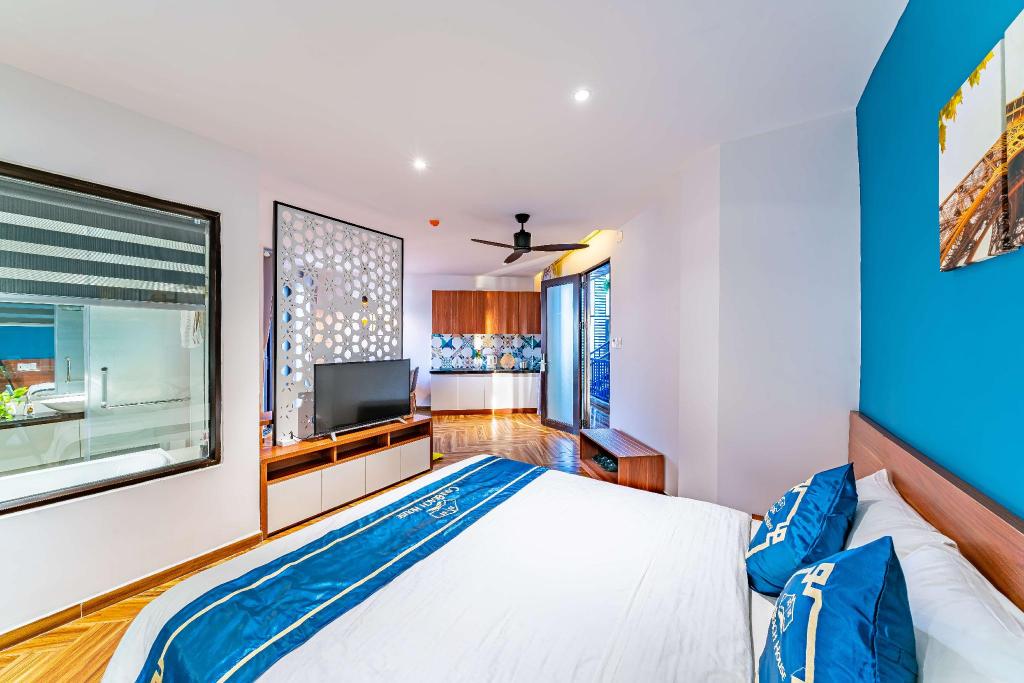 Premium suite bedroom at Cani Beach House, with a sea view through the window