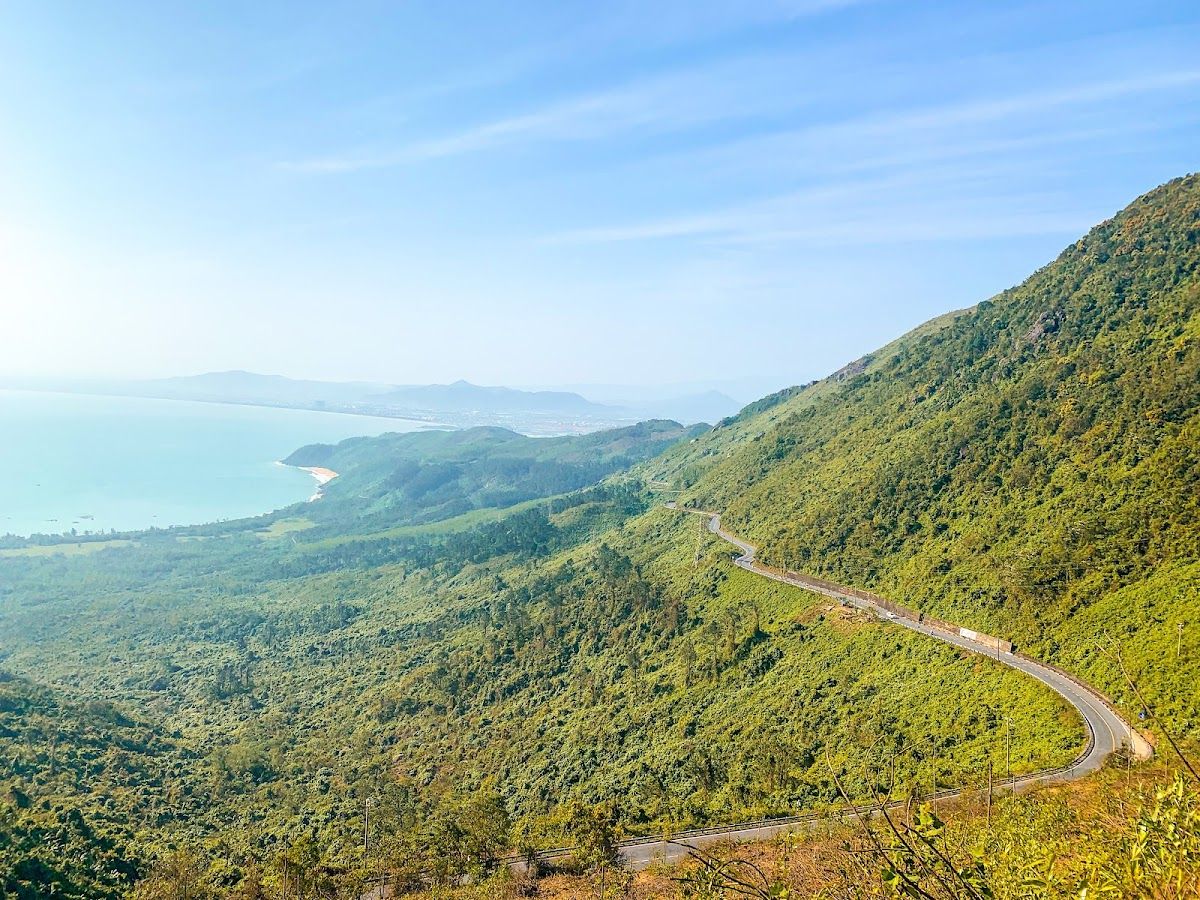 The winding road of Hai Van Pass with the coast and Lang Co lagoon visible below
