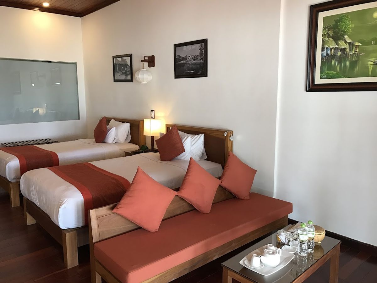 Vinh Hung Riverside Resort & Spa pool and grounds in Cua Dai